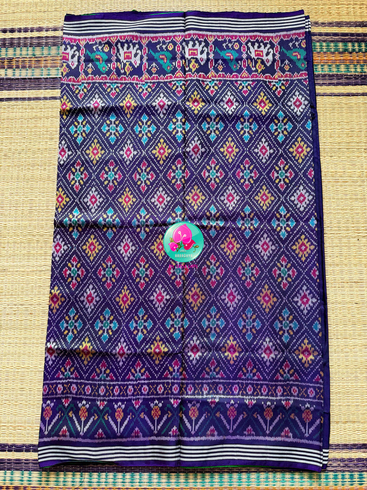 The Mirror of Mastery: Reversible Emerald & Amethyst Twill Patola Saree