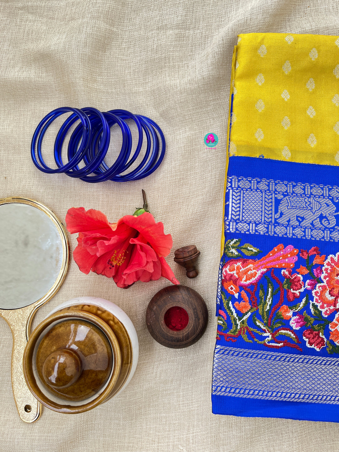 Yellow saree with royal blue embroidered border