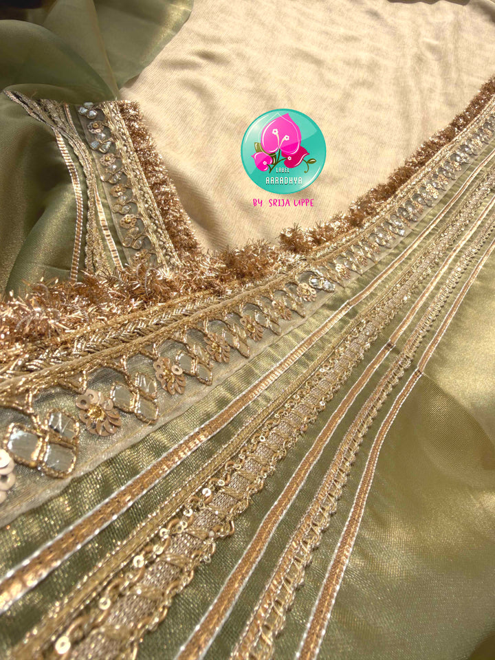 The Minted Glimmer: Light Green Gold Tissue Organza Saree with Bottle Green Brocade Artistry
