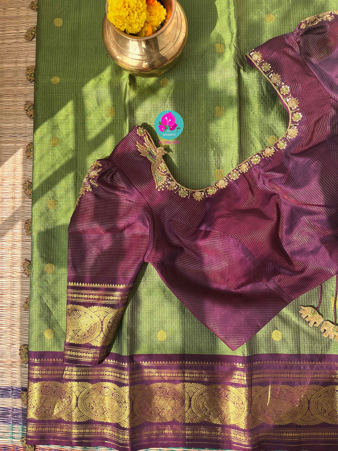 Nature’s Royalty: Olive Green Vaira Oosi Silk Saree with Deep Plum Border & Elephant Tassels