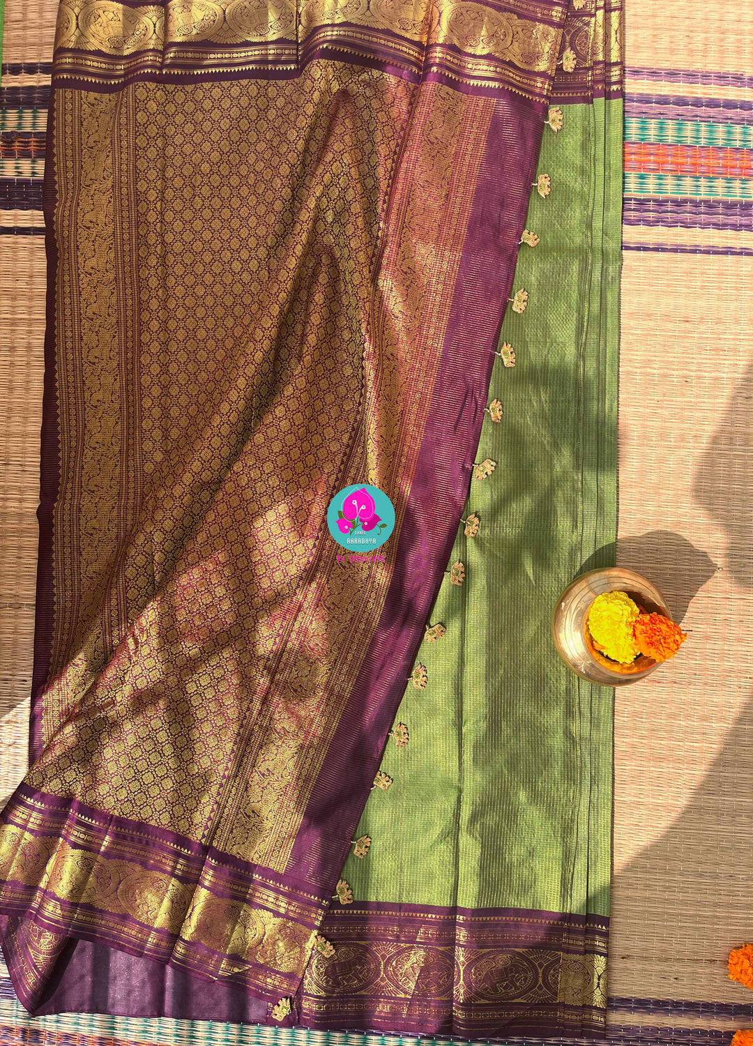 Nature’s Royalty: Olive Green Vaira Oosi Silk Saree with Deep Plum Border & Elephant Tassels