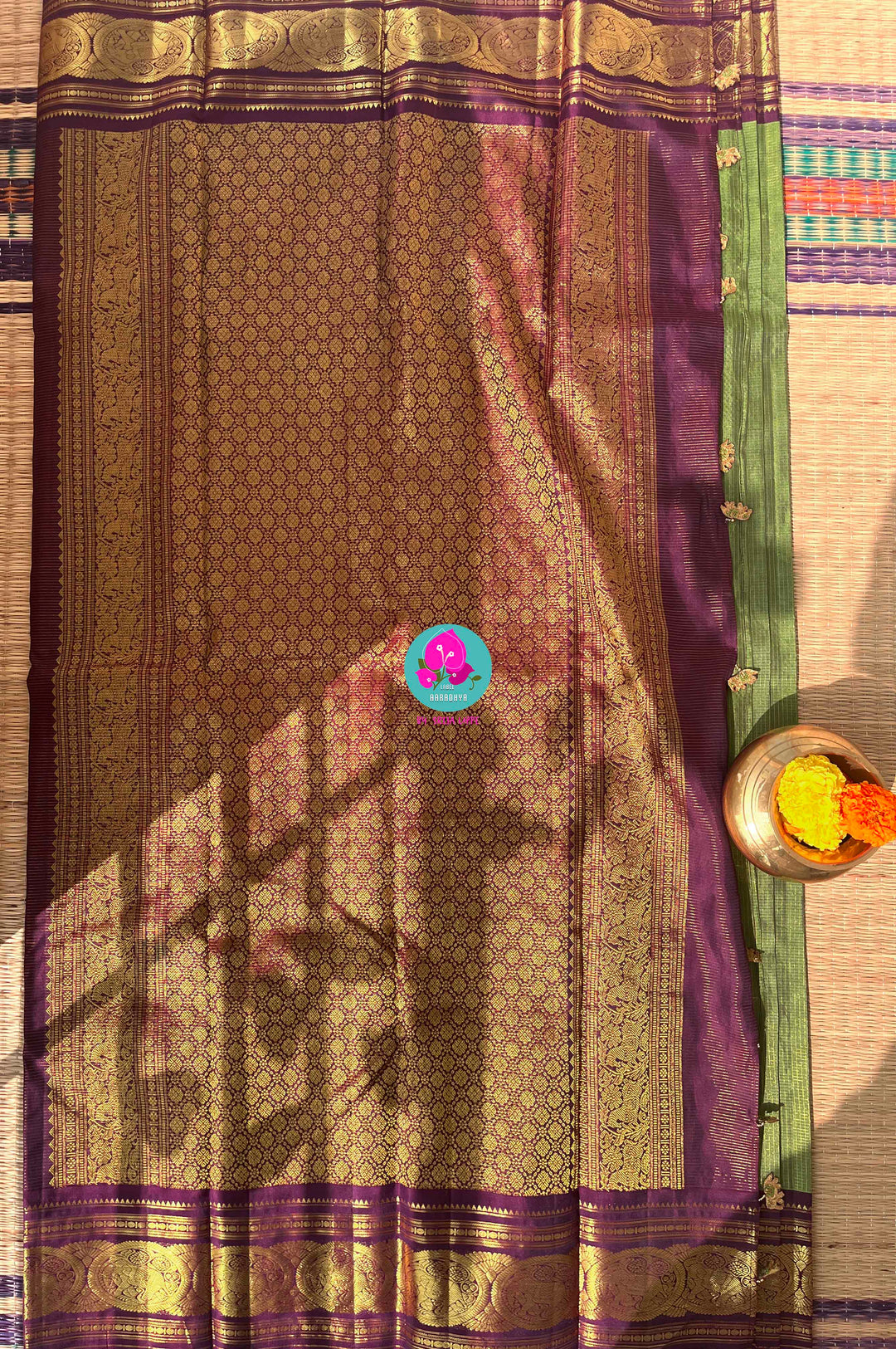 Nature’s Royalty: Olive Green Vaira Oosi Silk Saree with Deep Plum Border & Elephant Tassels
