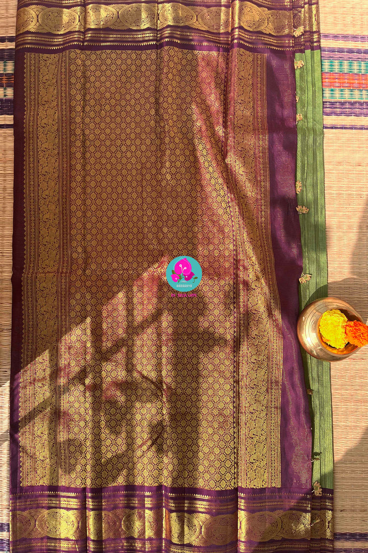 Nature’s Royalty: Olive Green Vaira Oosi Silk Saree with Deep Plum Border & Elephant Tassels
