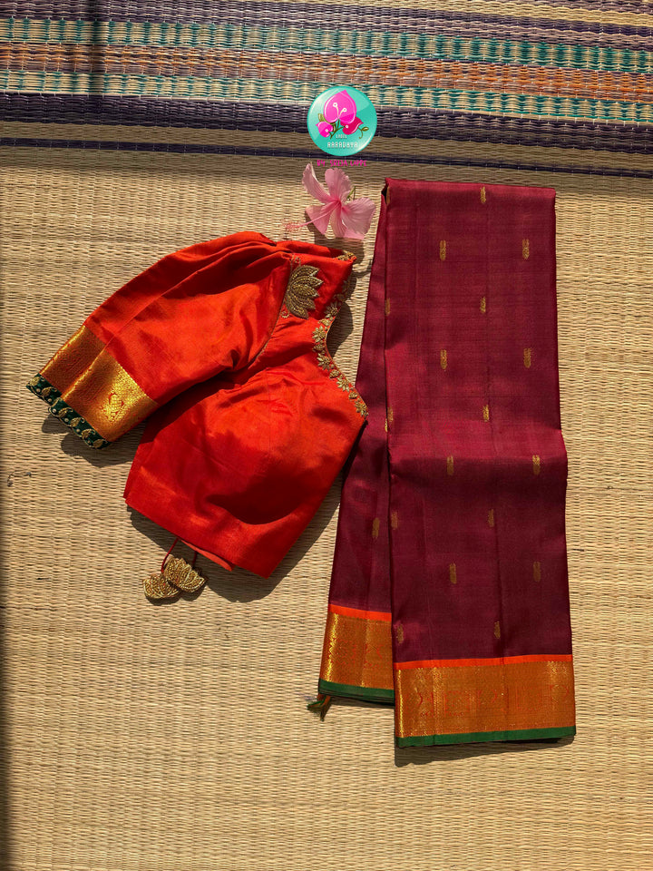 The Crimson Hearth: Maroon Kanchipattu Saree with Radiant Orange Artistry