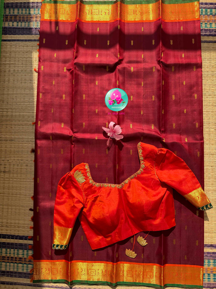 The Crimson Hearth: Maroon Kanchipattu Saree with Radiant Orange Artistry