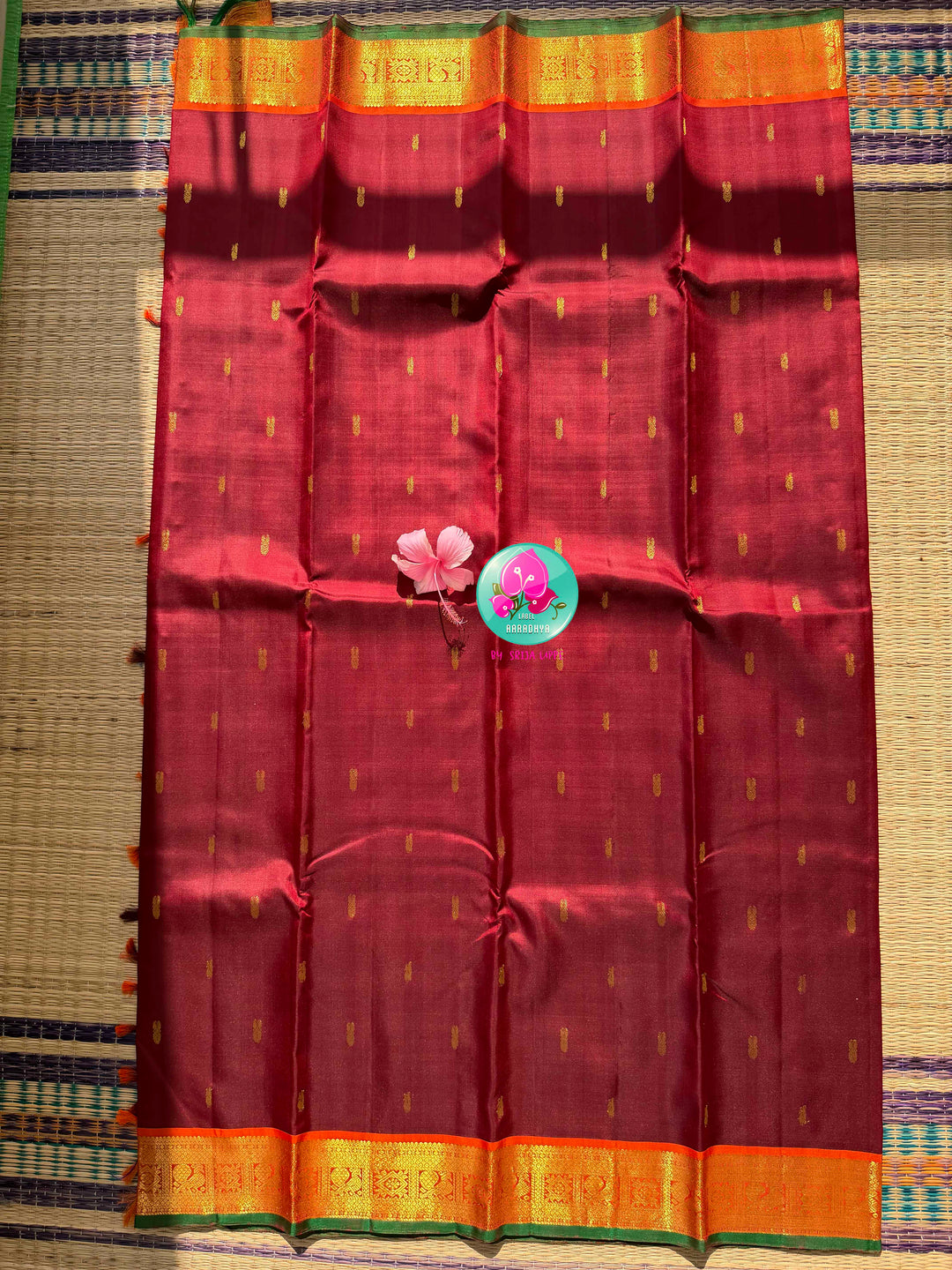 The Crimson Hearth: Maroon Kanchipattu Saree with Radiant Orange Artistry