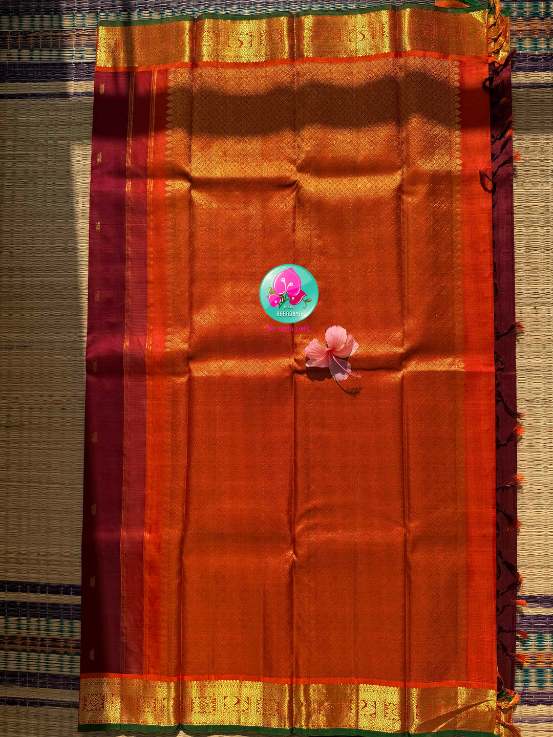 The Crimson Hearth: Maroon Kanchipattu Saree with Radiant Orange Artistry