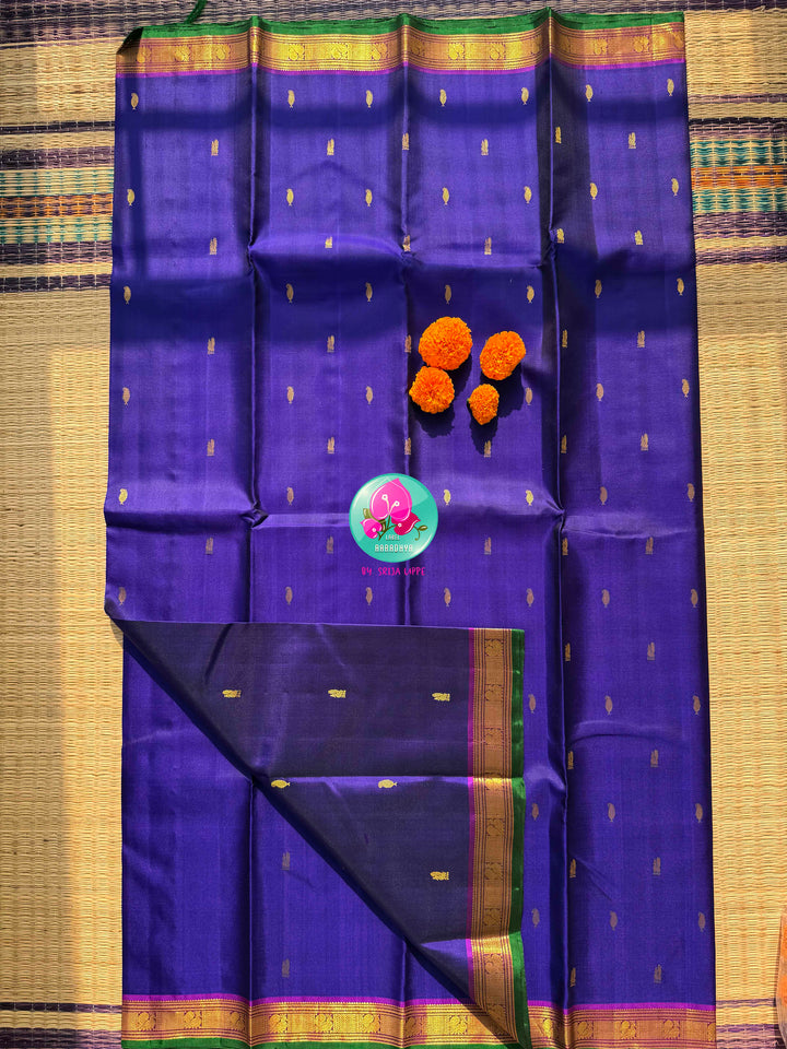 The Sapphire Sovereign: Royal Blue Kanchipattu Saree with Purple Hand-Embroidered Artistry