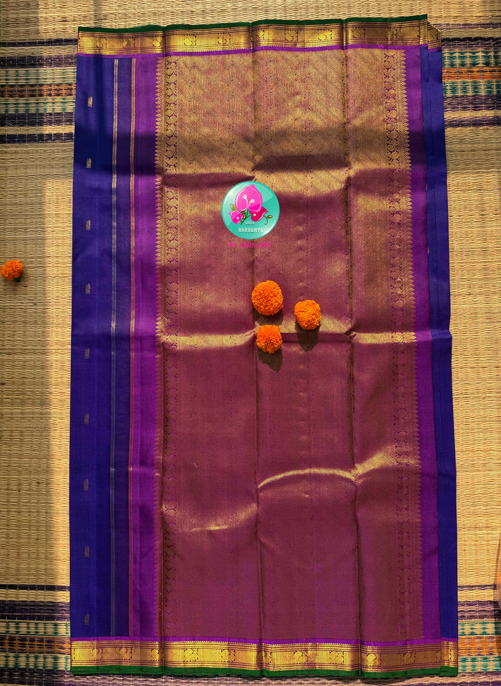 The Sapphire Sovereign: Royal Blue Kanchipattu Saree with Purple Hand-Embroidered Artistry