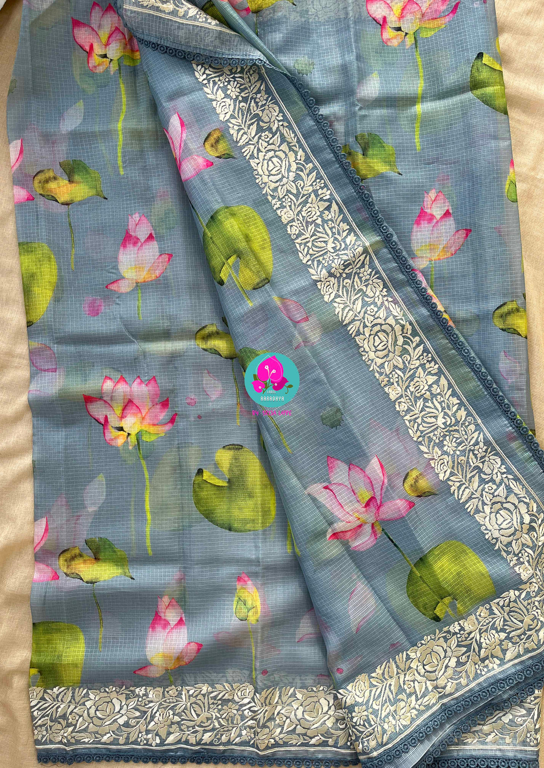 Kota silk saree in pretty floral design With embroidery at border paired with full sleeves blouse