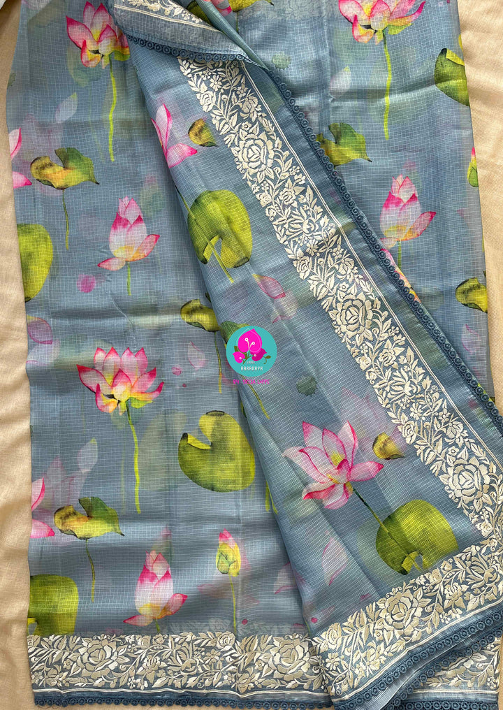 Kota silk saree in pretty floral design With embroidery at border paired with full sleeves blouse