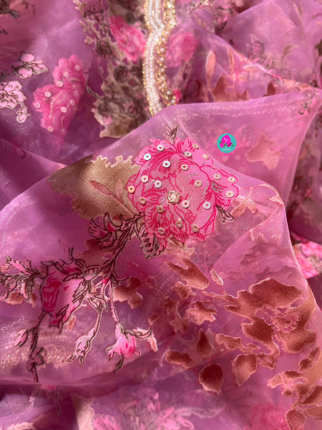 Brasso organza saree with hand embroidery paired with hand embroidered stitched blouse