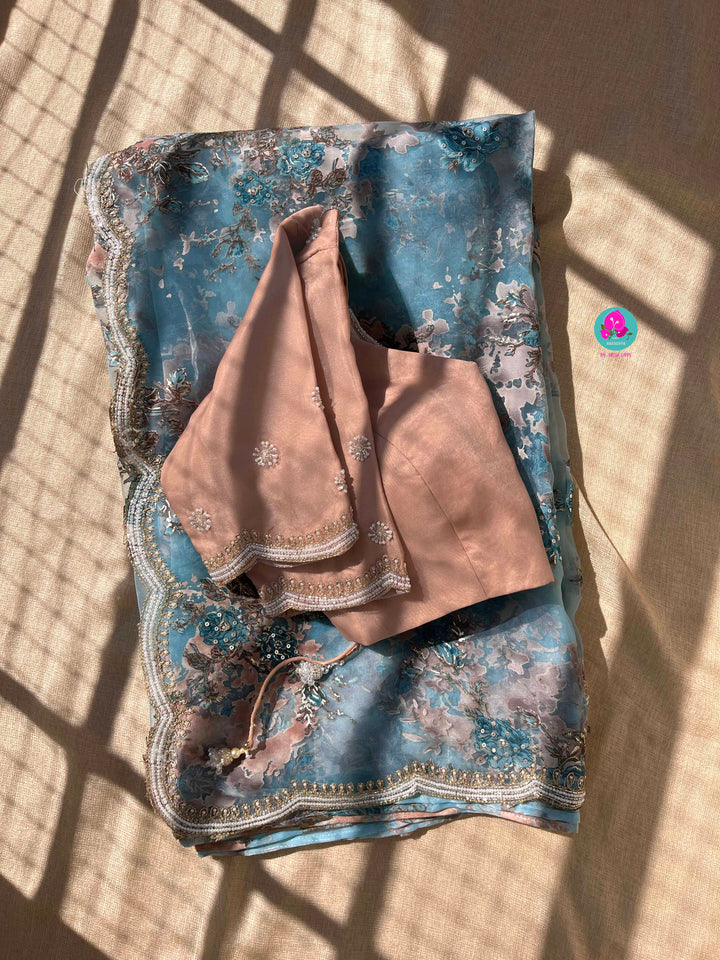 Brasso organza saree with hand embroidery paired with hand embroidered stitched blouse