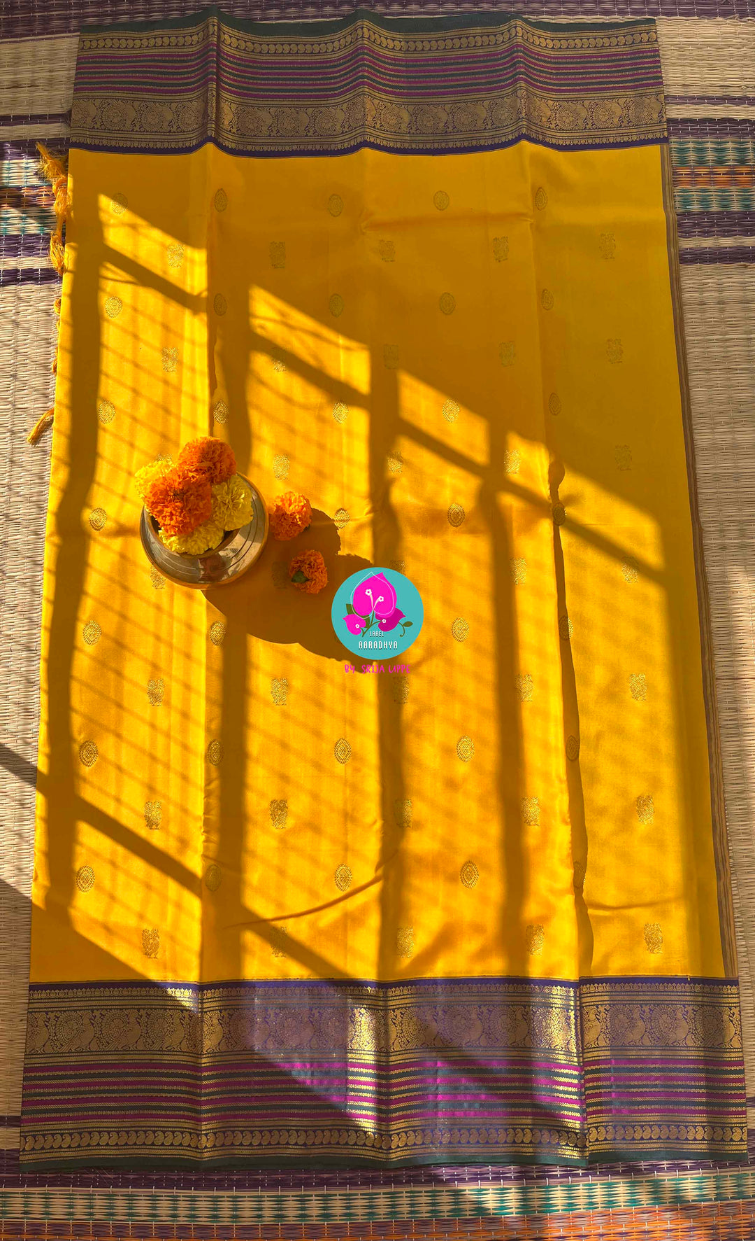 Suvarna Ganneru Splendor: Vintage Yellow Kanchipattu Saree with Artisan Blue Blouse