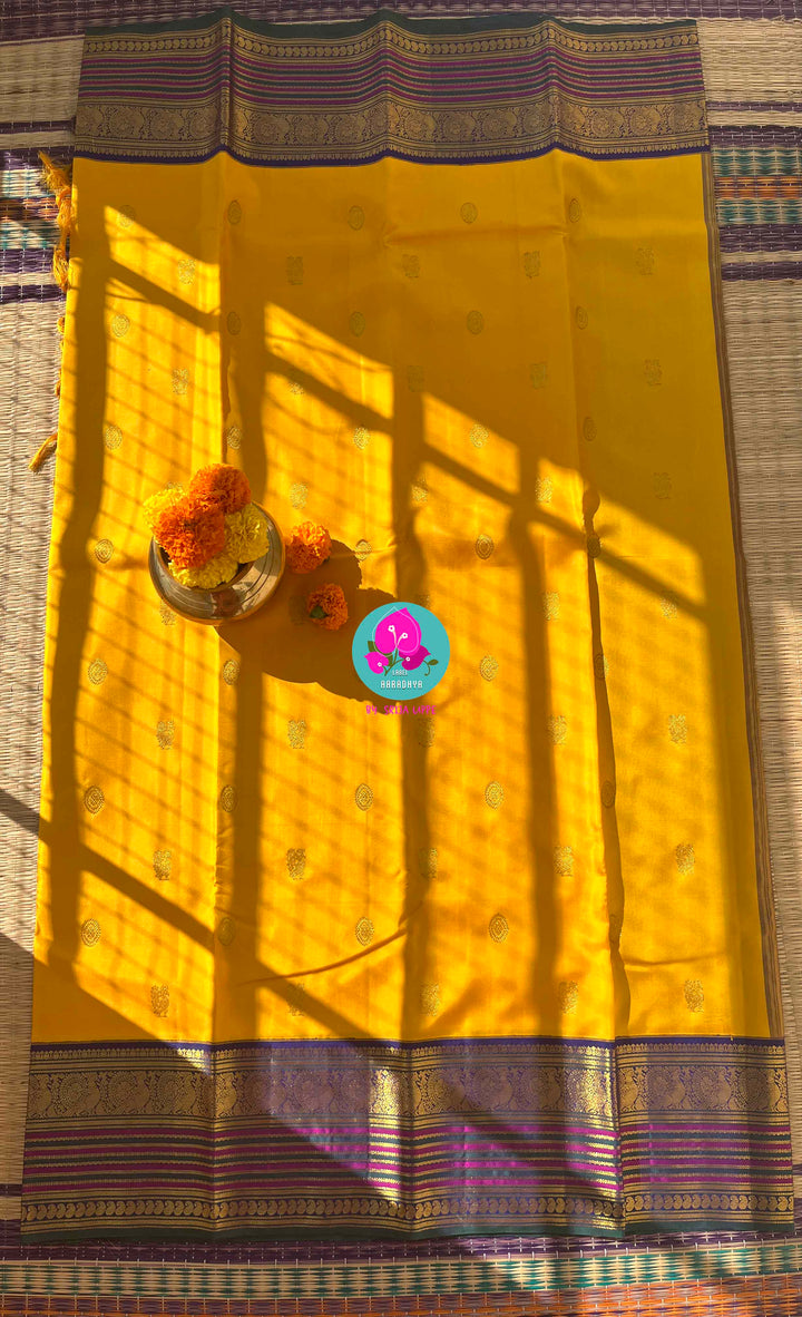 Suvarna Ganneru Splendor: Vintage Yellow Kanchipattu Saree with Artisan Blue Blouse