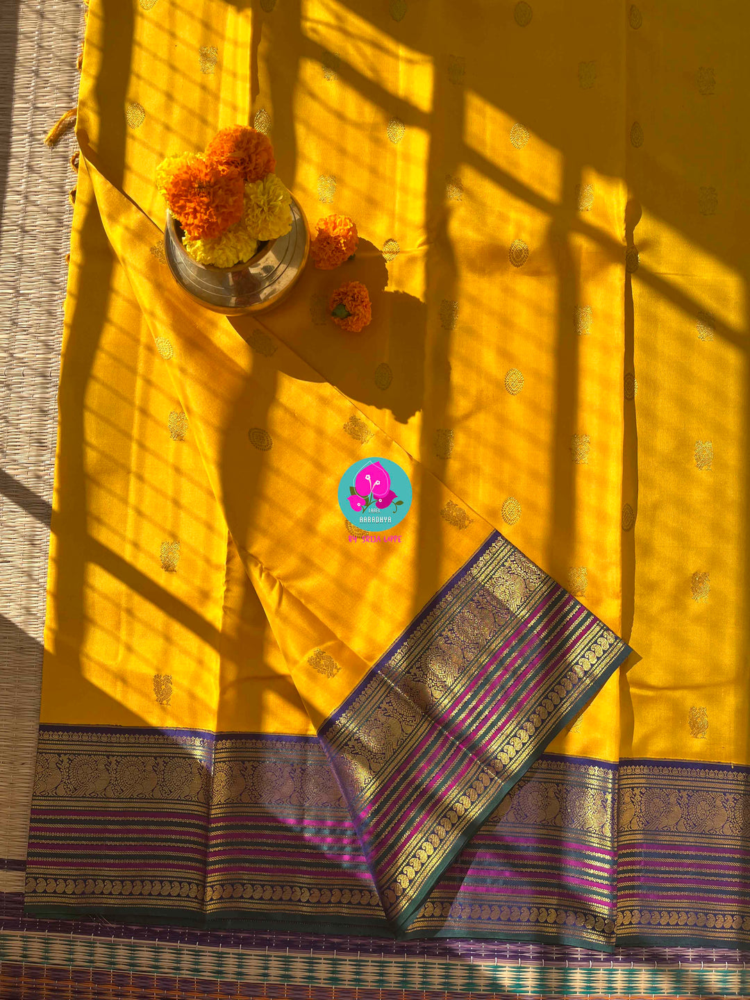 Suvarna Ganneru Splendor: Vintage Yellow Kanchipattu Saree with Artisan Blue Blouse