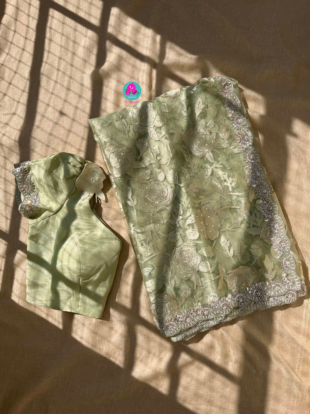Brasso organza saree with hand embroidery paired with hand embroidered stitched blouse