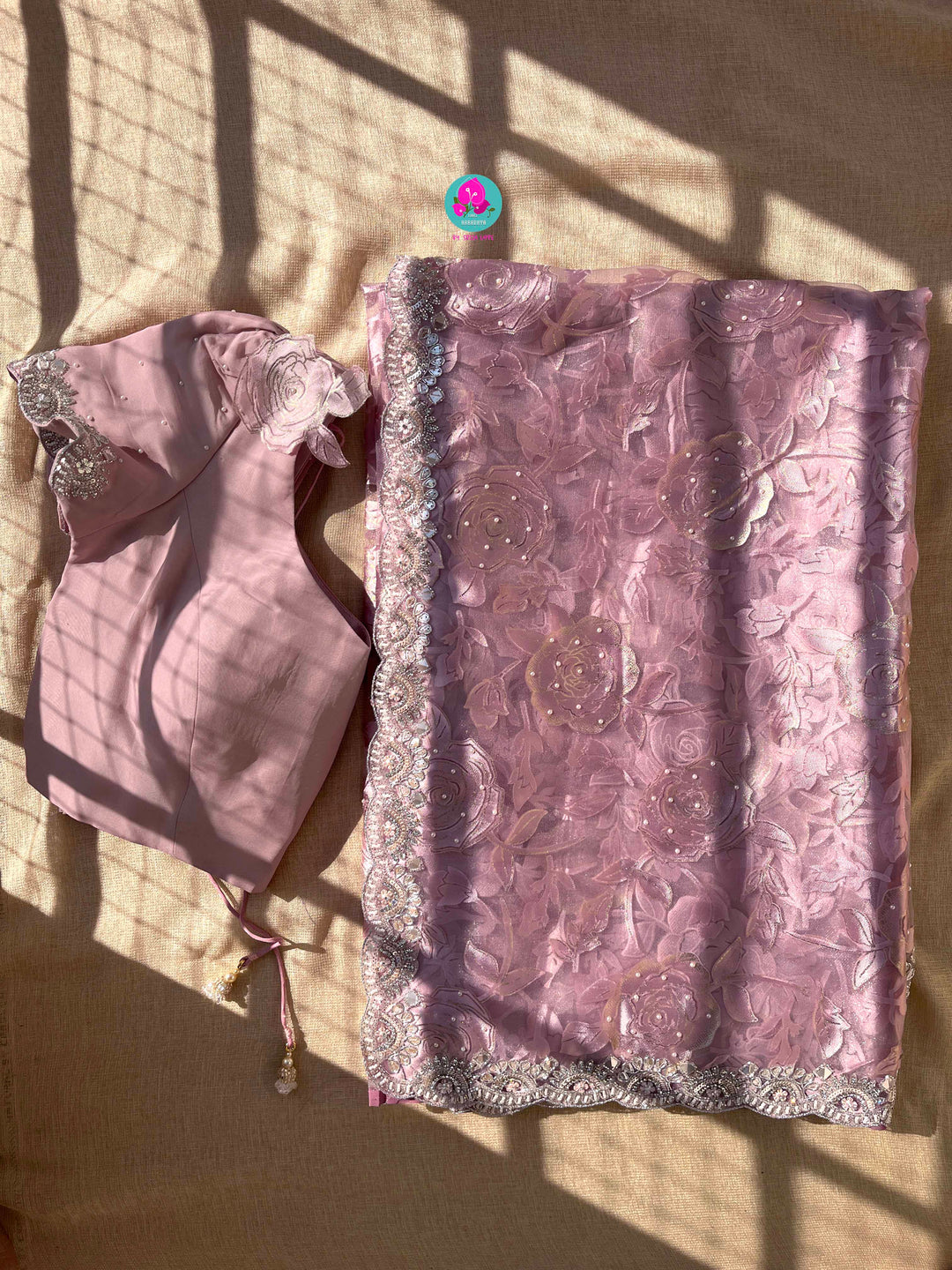 Brasso organza saree with hand embroidery paired with hand embroidered stitched blouse