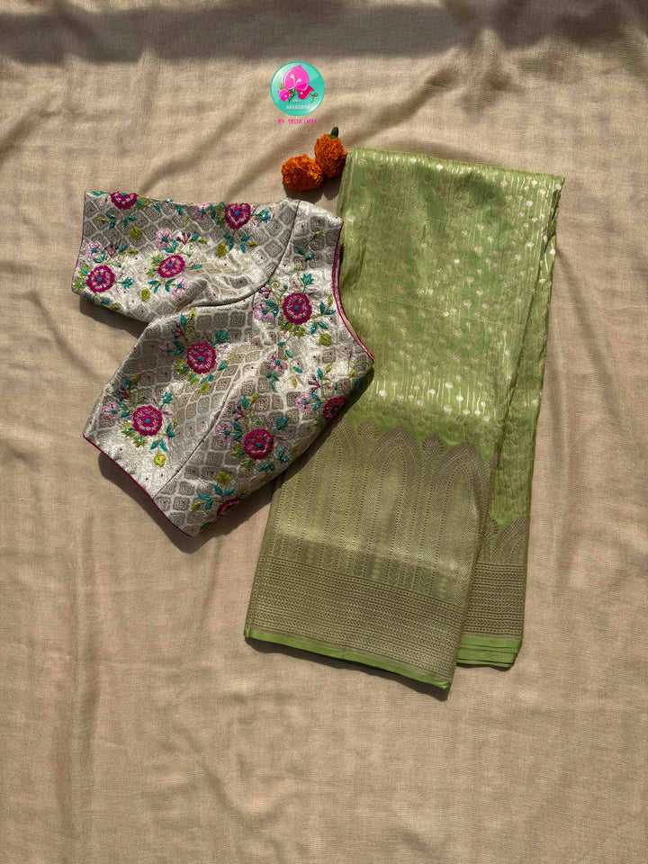 Luminous Pastel Brocade: Pista Green All-Over Woven Banarasi Silk Saree with Silver Brocade Statement Floral Embroidered Blouse