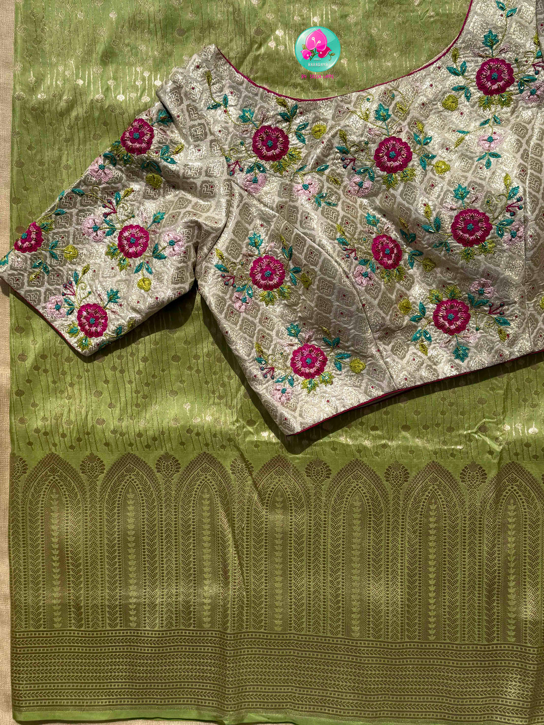 Luminous Pastel Brocade: Pista Green All-Over Woven Banarasi Silk Saree with Silver Brocade Statement Floral Embroidered Blouse