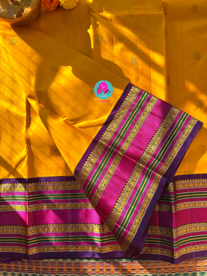 2G Zari Pure Kanchipuram saree with Yellow paired with hand embroidered contrast blouse