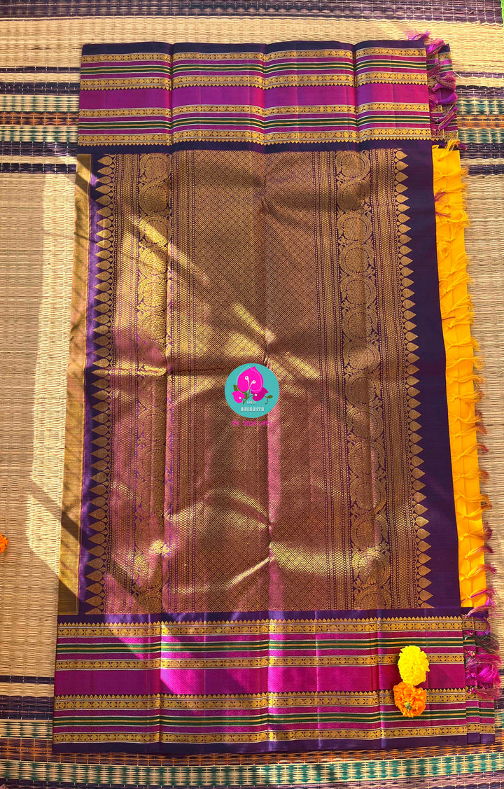 2G Zari Pure Kanchipuram saree with Yellow paired with hand embroidered contrast blouse