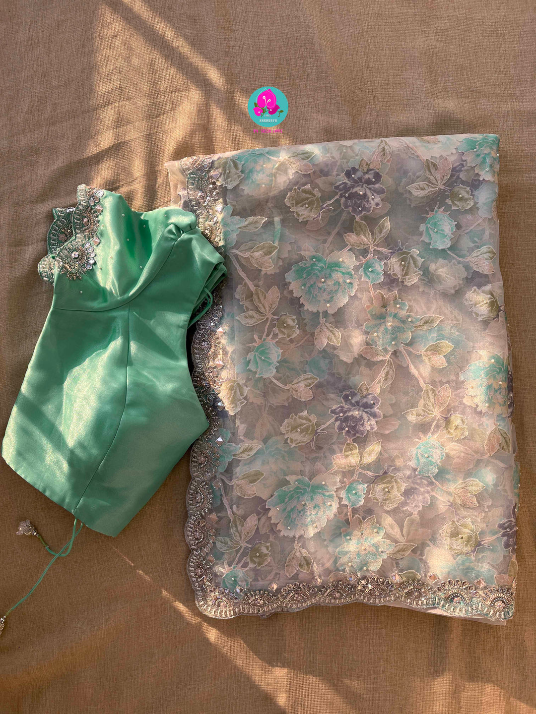 Brasso organza saree with hand embroidery paired with hand embroidered stitched blouse