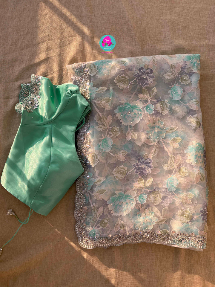 Brasso organza saree with hand embroidery paired with hand embroidered stitched blouse