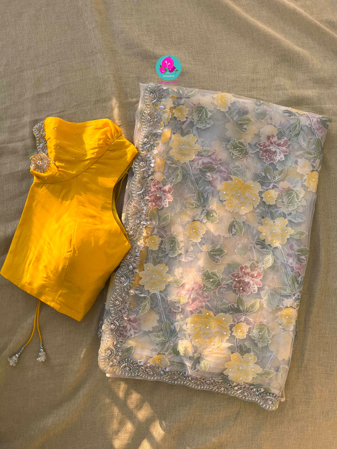 Brasso organza saree with hand embroidery paired with hand embroidered stitched blouse