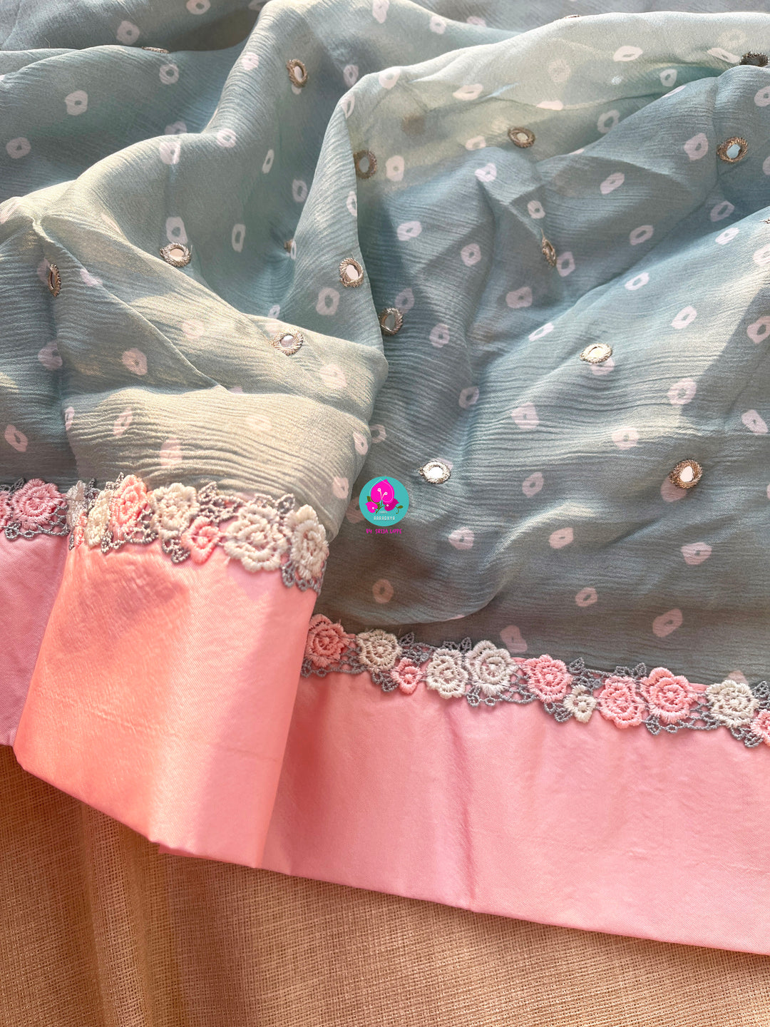 Pure Natural Crape Saree with Mirror Work and Rosy Floral border Paired with blouse