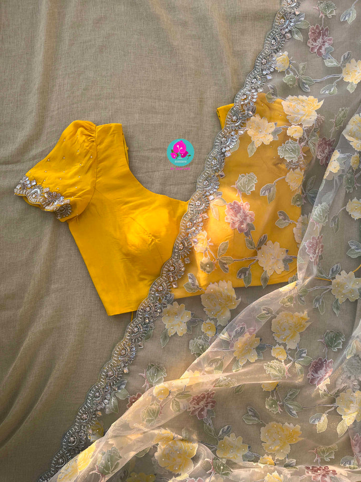 Brasso organza saree with hand embroidery paired with hand embroidered stitched blouse