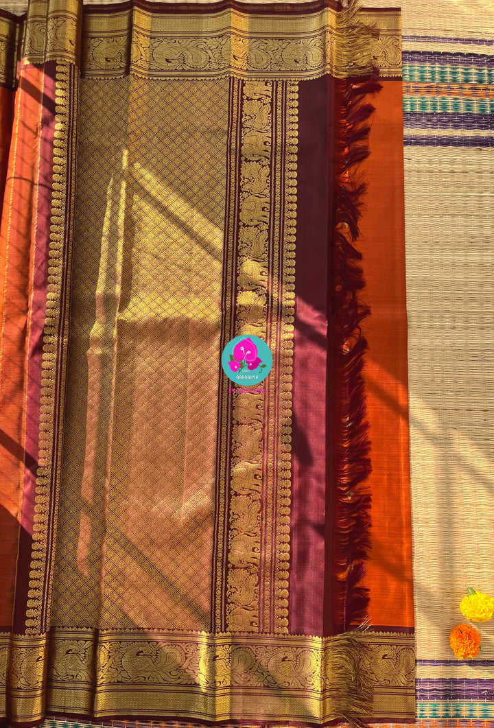 Pure Kanchipattu saree in vintage rust orange and brown border with hand embroidered blouse