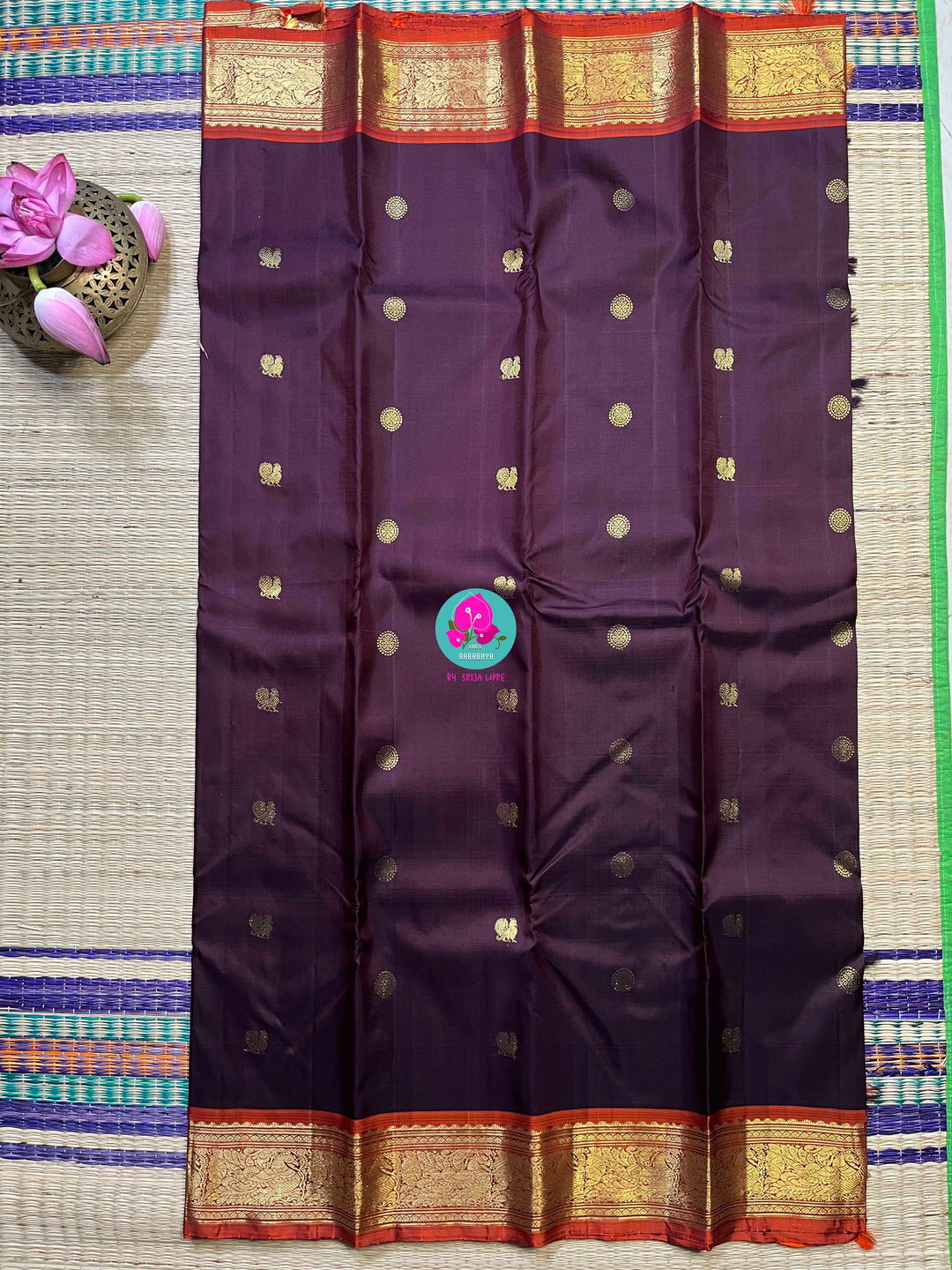 Pure Kanchipattu saree in traditional brown and orange is the classiest and elegant saree