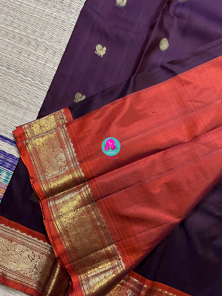 Pure Kanchipattu saree in traditional brown and orange is the classiest and elegant saree