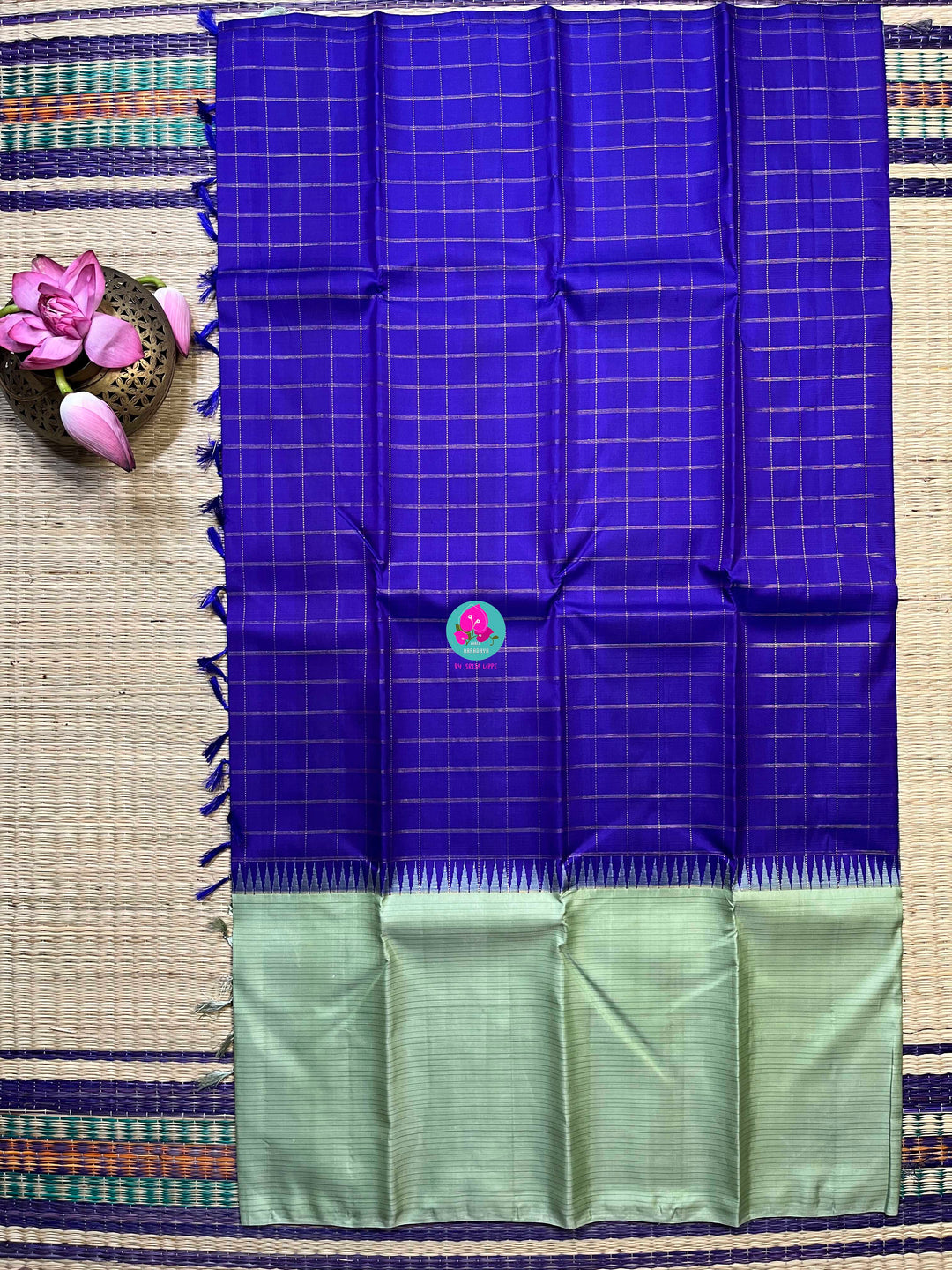 Royal blue checkered saree with a touch of pastel pista color