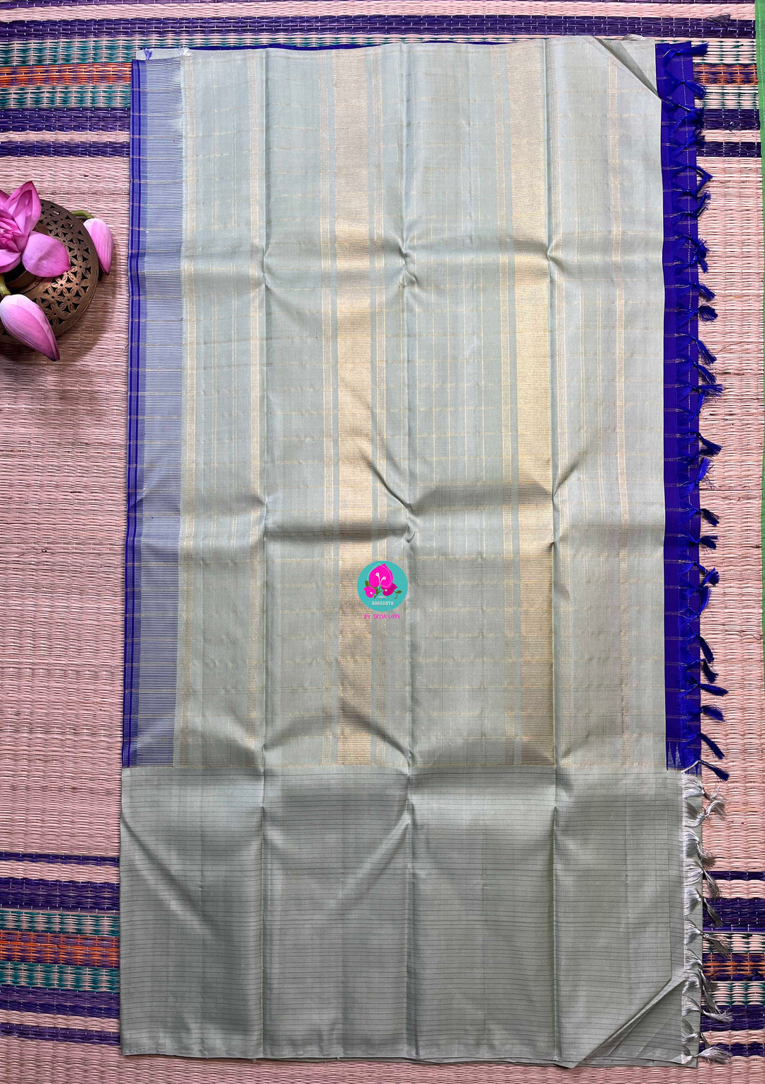 Royal blue checkered saree with a touch of pastel pista color