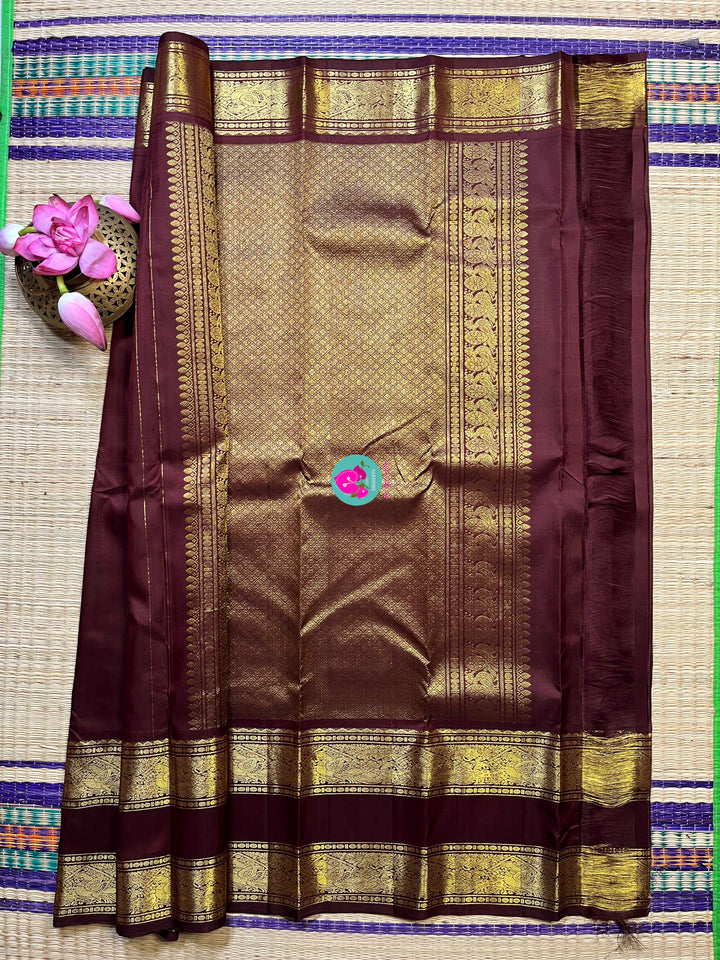 Kanchipuram 2g zari brown vintage saree with gap border