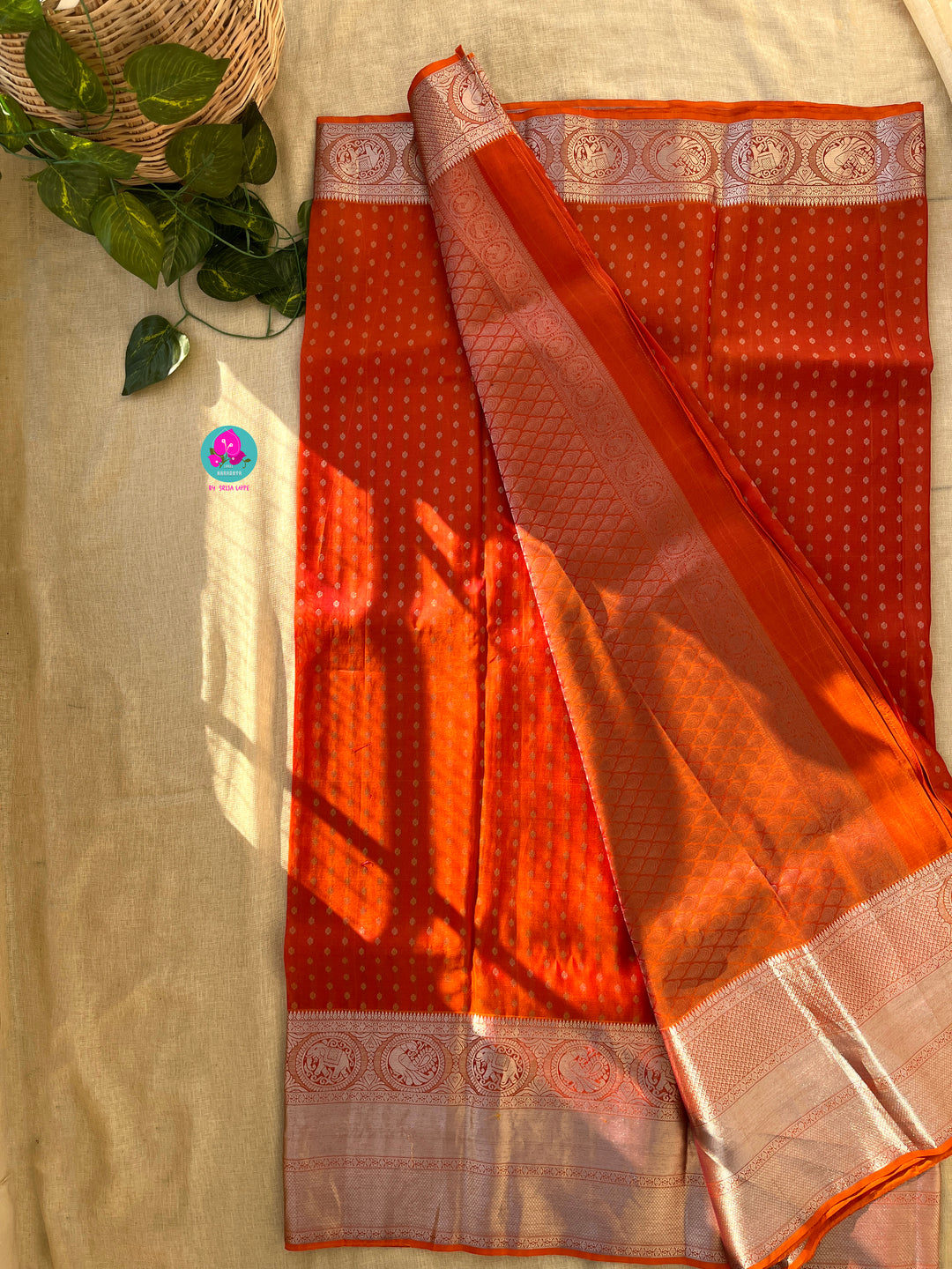 Dark orange silk saree with Bandhani georgette blouse