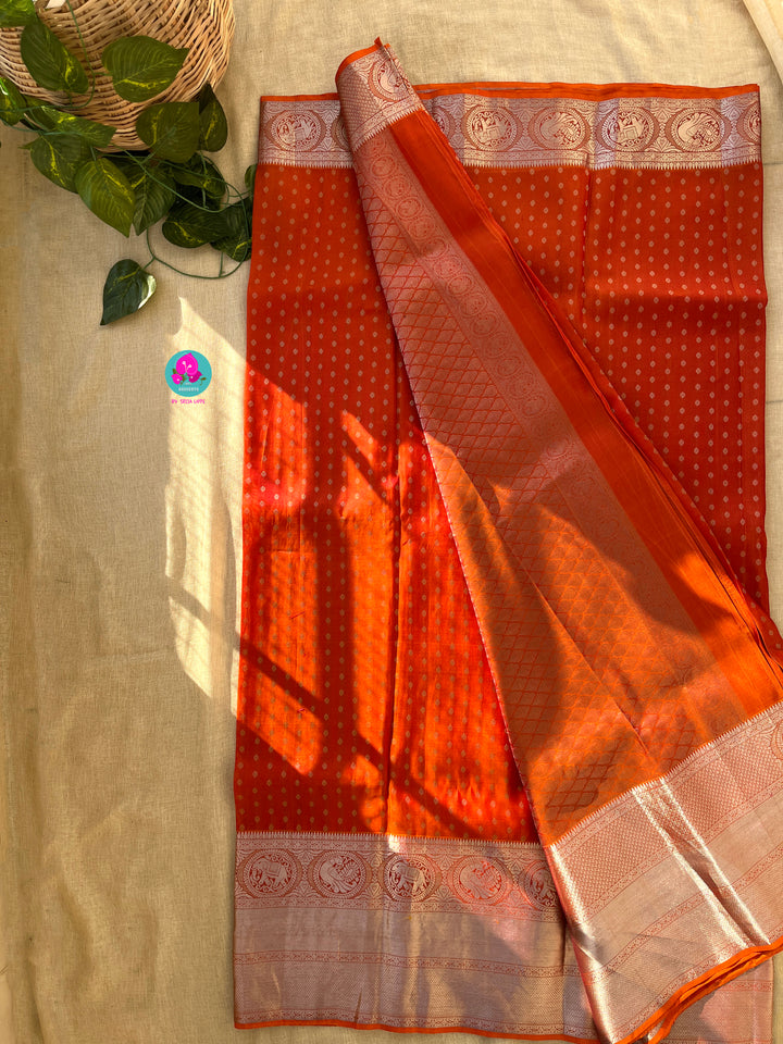 Dark orange silk saree with Bandhani georgette blouse