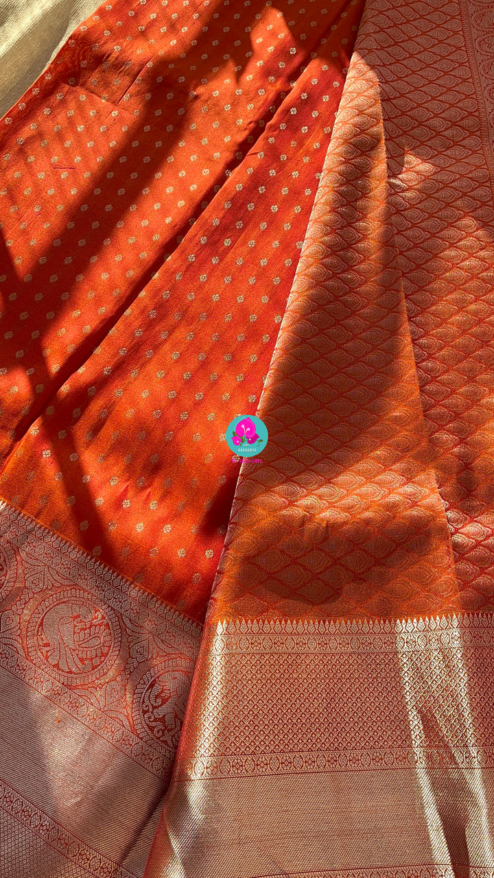 Dark orange silk saree with Bandhani georgette blouse