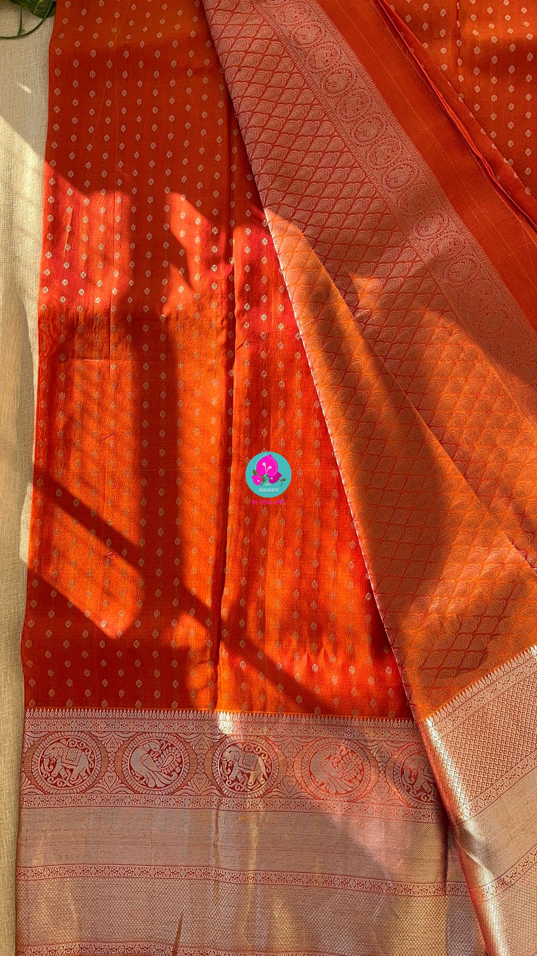Dark orange silk saree with Bandhani georgette blouse