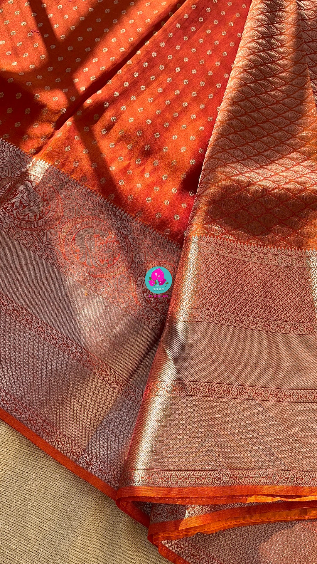 Dark orange silk saree with Bandhani georgette blouse