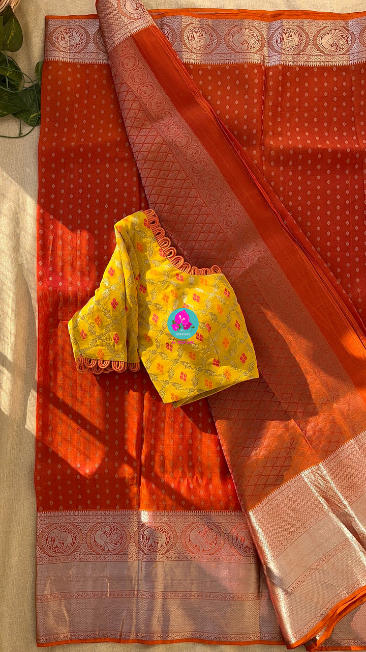Dark orange silk saree with Bandhani georgette blouse