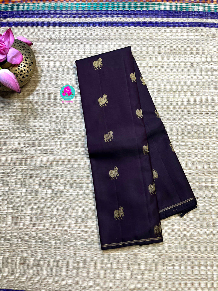 Kanchipattu handloom zari Nandhini motifs all over the saree, on a classy shade brown