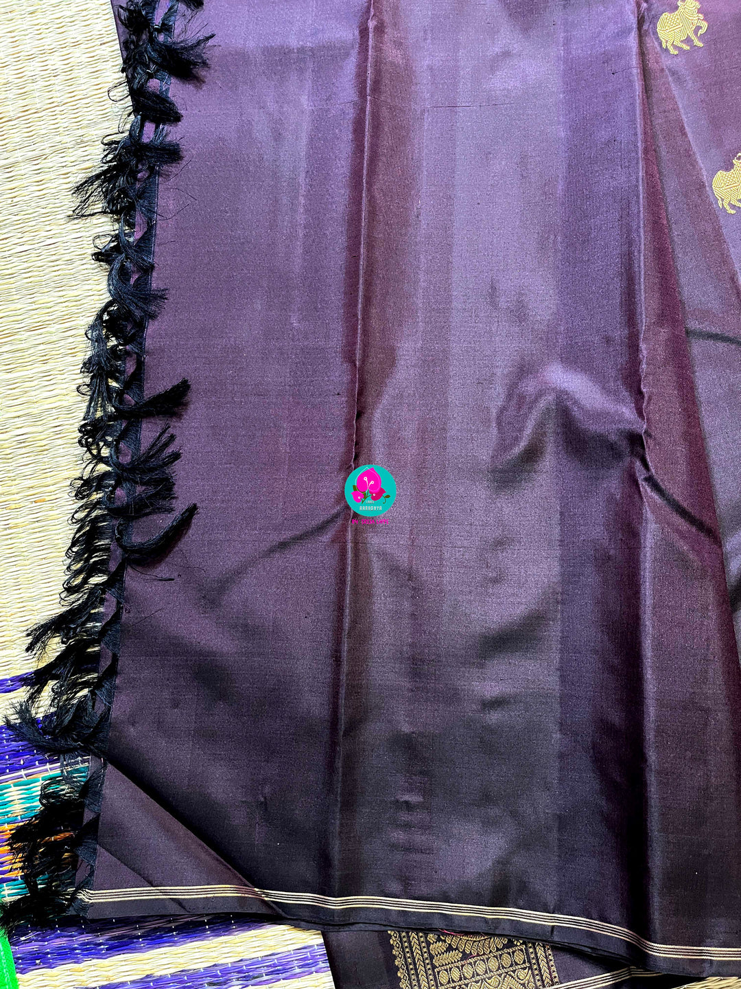 Kanchipattu handloom zari Nandhini motifs all over the saree, on a classy shade brown