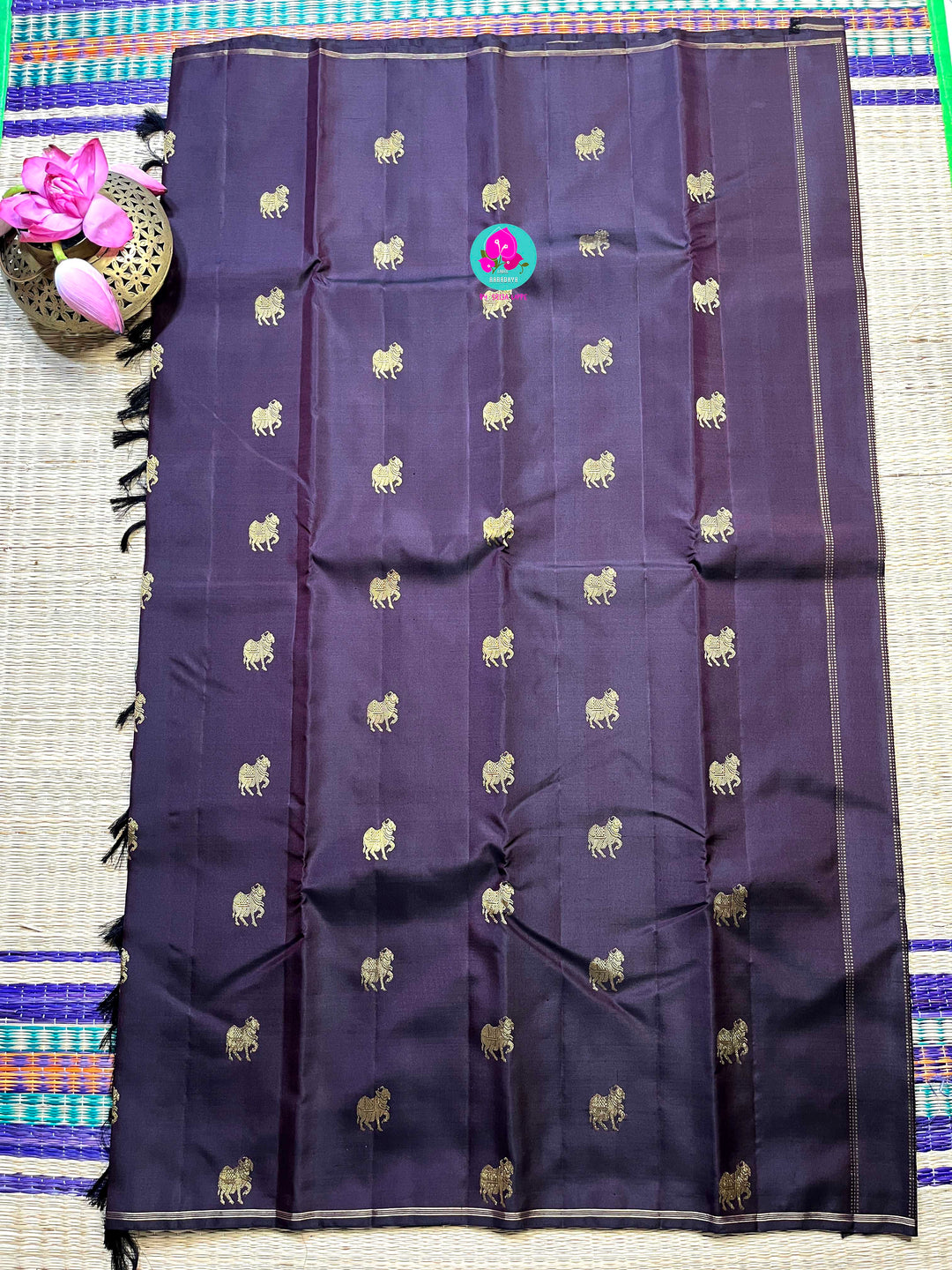Kanchipattu handloom zari Nandhini motifs all over the saree, on a classy shade brown