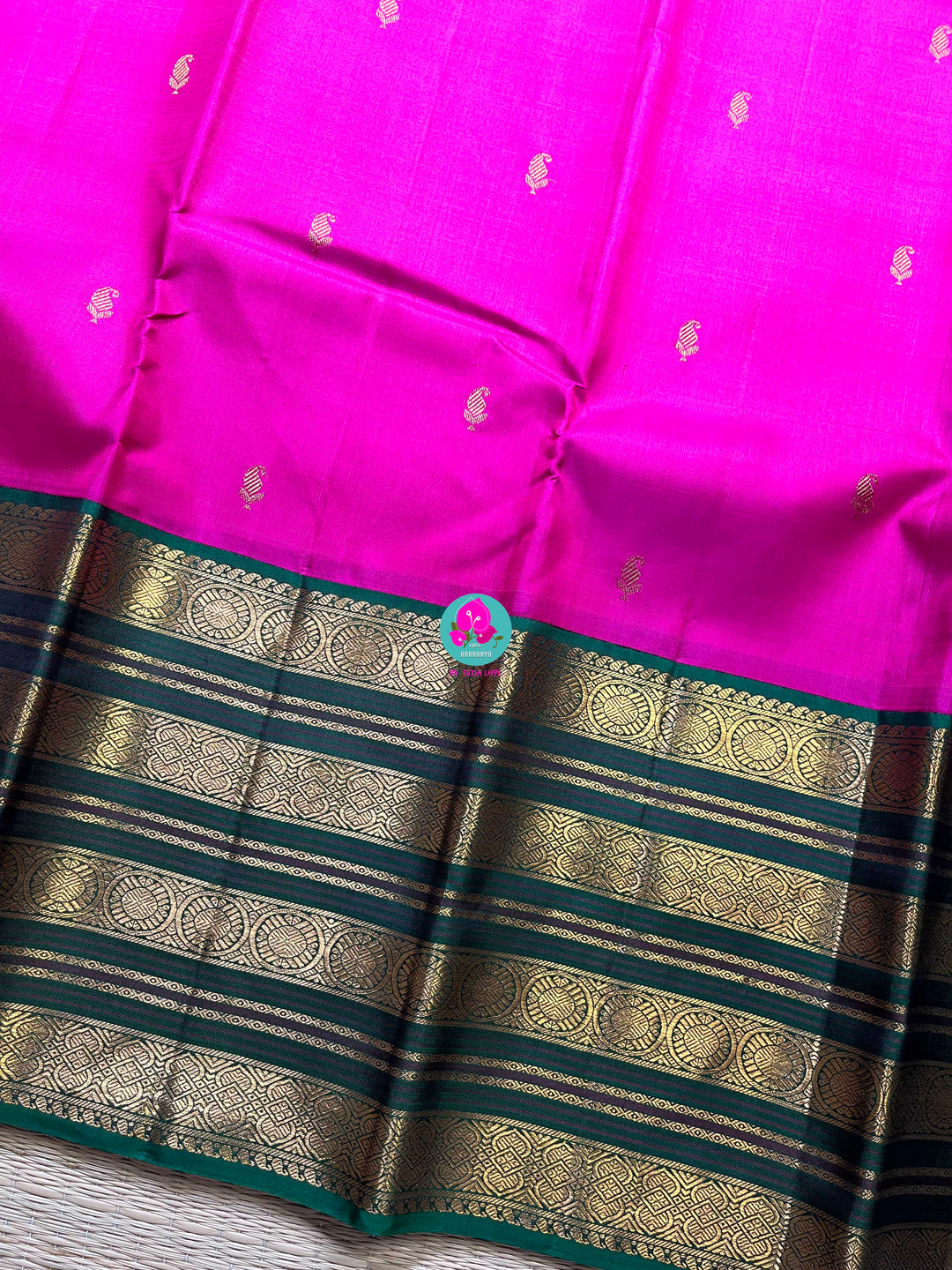 2g zari traditional border in pink and green combination is the perfect vintage contrast