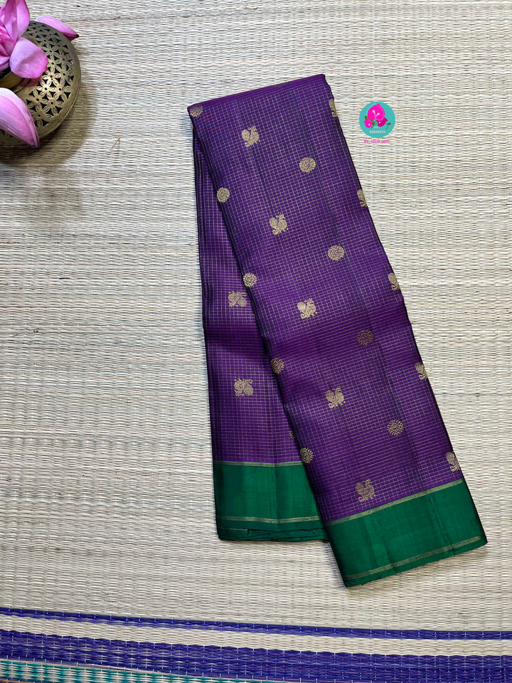 Pure zari purple saree with green constrast gap border