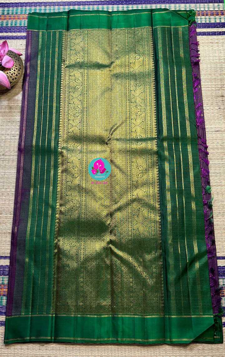 Pure zari purple saree with green constrast gap border