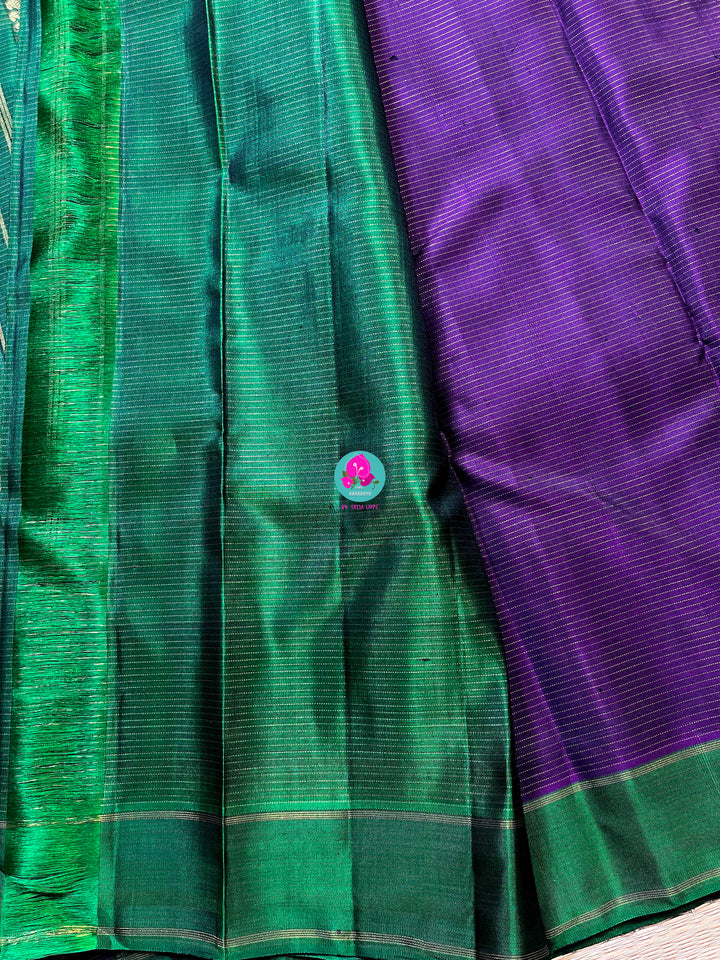 Pure zari purple saree with green constrast gap border